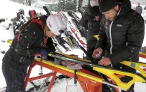 Harvard&rsquo;s Nordic ski team head coach Chris City tests waxes with racer Alena Tofte &rsquo;13 before the Dartmouth Carnival in Craftsbury, Vermont, last winter.