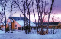 Maine Huts &amp; Trails offers winter sunsets in the wilderness (along with food, hot showers, and convivial company) at the Stratton Brook Hut.