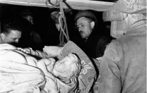 Stout (center) and Steven Kovalyak (far left) supervise the removal of Michelangelo’s <em>Bruges Madonna</em> from the salt mine at Altaussee, Austria.