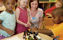 Teacher Meghan McDonough plays with preschoolers.