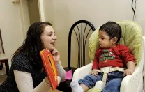 The social workers are concerned with child development, broadly defined: they recognize that professional and personal fulfillment supports maternal mental health. During the same visit, social worker Sarah McLanahan plays with Miguel.