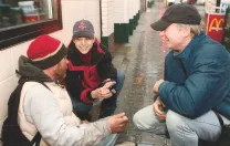 Even as BHCHP president, O’Connell spends time on the street. Here, he and physician assistant Jill Roncarati check on a homeless man.