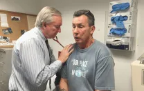 Jim O’Connell checks longtime patient Joe Meuse.