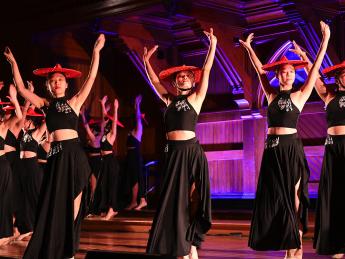 Students performing dance on stage