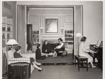 A group of Radcliffe students socialize in a common room in Moors Hall circa 1950. 