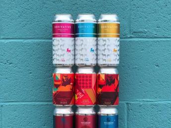 A colorful stack of beer cans against a blue wall