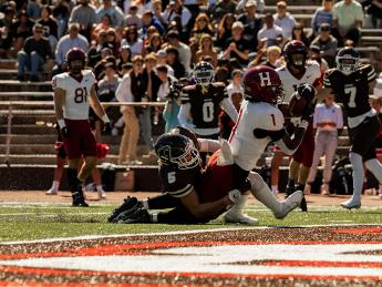 Harvard’s Kym Wimberly scores his second touchdown.