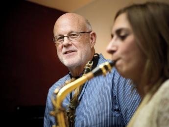 John Payne teaches a saxophone student at his music center in Brookline, Massachusetts.