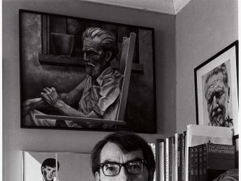 Davenport at home in 1975, with two of his own works behind him. An image of Ezra Pound by Richard Avedon partners Davenport’s portrait.