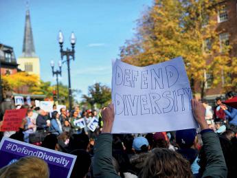 Supporters of affirmative action protest in Harvard Square. A poster reads, "Defend Diversity."