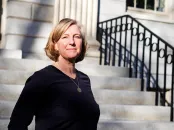 Hopi Hoekstra stands on the stairs of University Hall