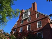 Gold clock on the top of Massachusetts Hall