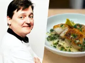 Chef standing confidently with arms crossed, alongside a plated fish dish with herbs.