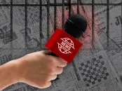 An image of a hand holding a microphone, representing a journalist