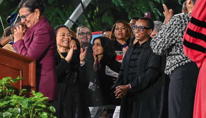 Senior fellow Penny Pritzker and President Claudine Gay on stage during Gay’s installation