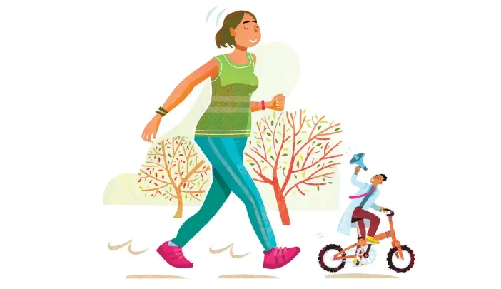 A woman jogs on a path beside a boy riding a bicycle, surrounded by trees.