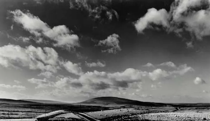 black and white scence of long road