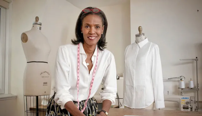 Designer Katiti Kirondé with her white shirts at the Fashion Lab of Fisher College in Boston