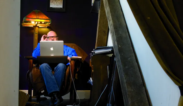 Andrew Sullivan in his “blog cave”