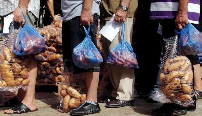 Hunger stalks southern Europe: A nationalist political party distributes food in Athens, September 14, 2012. 