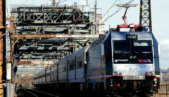 A New Jersey Transit train crosses a 1910 bridge in Kearney, N.J., over which 150,000 to 200,000 passengers cross daily&mdash;making it perhaps the busiest rail span in the Western Hemisphere. It is obsolete, but a $940-million plan to replace it remains unfunded. 
