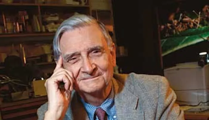 E. O. Wilson with his new <i>Pheldole</i> monograph and a specimen tray from the Museum of Comparative Zoology collection.