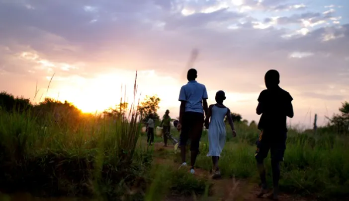 Children from New Hope orphanage in Busia, Uganda, make their nightly walk to get water for drinking and washing. They handle all the chores themselves—an important part of director Ken Mulago’s strategy for running the orphanage. “We want our children to behave as responsible adults,” he says. “We don’t want to raise them up just to think about themselves.”