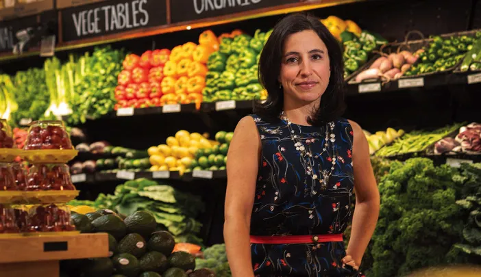 Emily Broad Leib in front of produce 