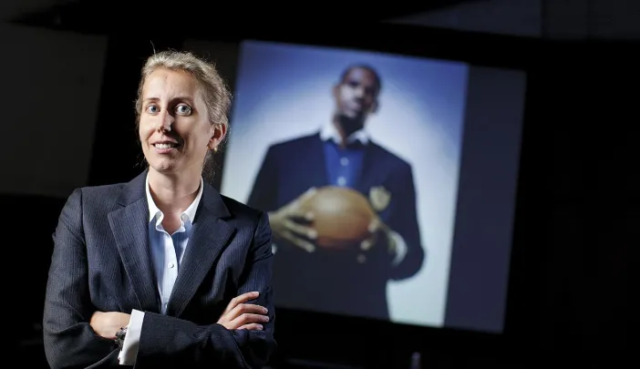 Anita Elberse, backed by a picture of basketball superstar LeBron James, an important figure in her book <i>Blockbusters</i> 