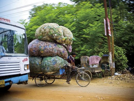 Globalization&rsquo;s benefits flow unevenly to a garbage collector in Allahabad, India, and a call-center worker in Bangalore.