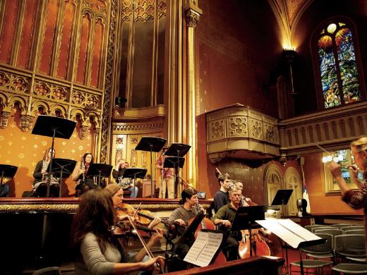 Sara Jobin conducts a rehearsal of <i>Purchase of Manhattan,</i> which premiered at the Marble Collegiate Church in November.