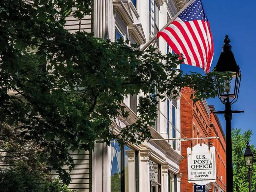 Historic buildings and American flag in Litchfield, Connecticut