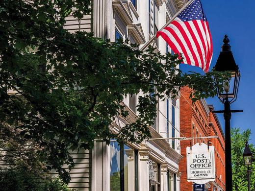 Historic buildings and American flag in Litchfield, Connecticut