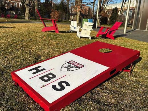 Harvard Business School logo on a campus cornhole board