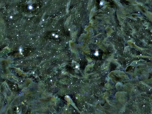 Part of the Perseus molecular cloud, as seen through the Smithsonian’s MMT telescope in Arizona. Self-gravitating structures—dense areas where stars are forming—appear as dark spots. The L1448 region is located in the upper-right quadrant of the image.