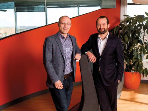 Yates (left) and Laskey have merged their talents—computer science and political communications—in Opower.