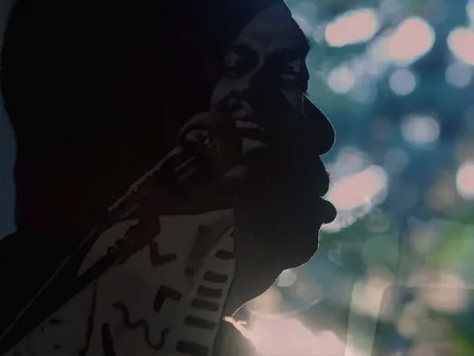 A still image from the film, This is Love, showing Rudy Love in shadowed profile