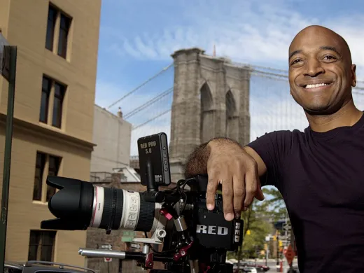 Film director Mustapha Khan near his home and studio, in the shadow of the Brooklyn Bridge 