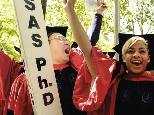 Displaying Ph.D.-powered pride are crimson-gowned Jin Cheng &ldquo;George&rdquo; Ye, Anouska Bhattacharyya, and Cammi Valdez.