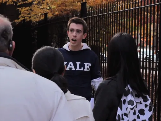 Image courtesy of <i>On Harvard Time</i> Samuel Clark, in costume, shows real tourists around Yale. He later said he was trying to be helpful.