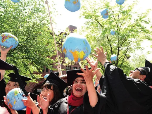 Kennedy School mid-career-degree celebrants (from left) Tadahiro Ikemoto, M.P.H. &rsquo;14, M.P.A. &rsquo;15, of Japan, Zhuldyz Bakytzhanova, M.P.A. &rsquo;15, Sahar Albazar, M.P.A. &rsquo;15, of Egypt, and Alvaro Henzler, M.P.A. &rsquo;15, of Peru