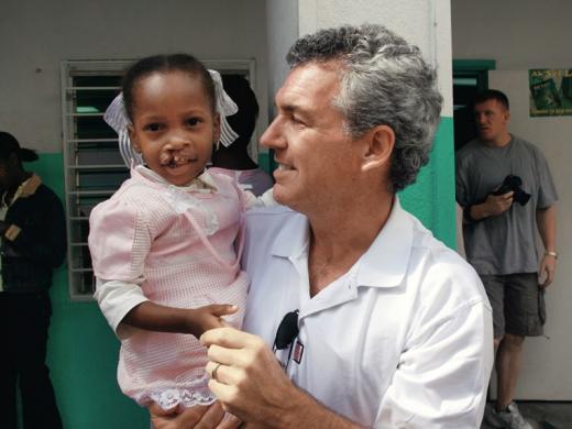 Brian Mullaney with a Haitian patient before her surgery this past February. Smile Train has provided roughly 160 surgeries in Haiti and recently launched “Cleft-free Haiti” to completely eradicate cleft there.