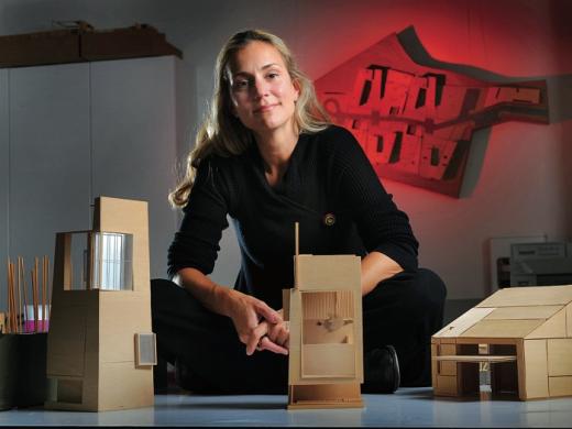 Elizabeth Whittaker, at her office in Boston, with basswood architectural models for residential and commercial structures