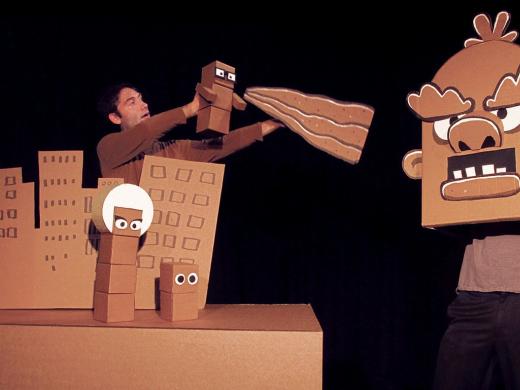 Brad Shur performing in his new show, Cardboard Explosion!