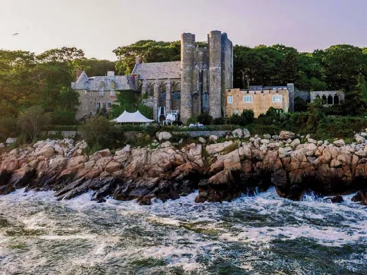 Majestic twentieth-century stone castle perched on Gloucester coastline