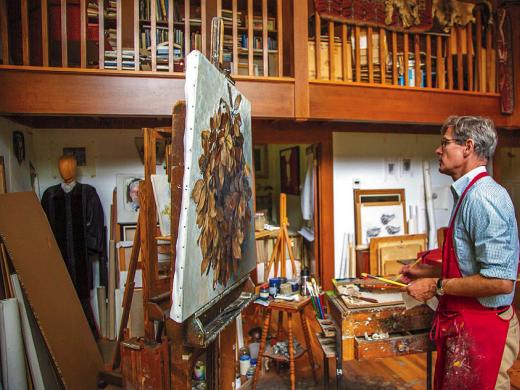 Jason Bouldin at work on a painting in his studio