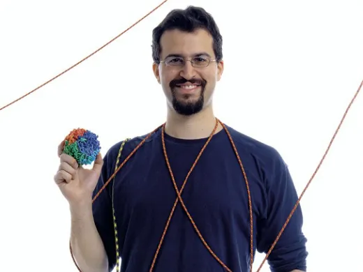 If it were not for an elegant design, your DNA might be a tangle of crossed lines and knots. Graduate student Erez Lieberman-Aiden was part of a team that discovered how the genome packs information accessibly into a tiny ball of hierarchical folds.