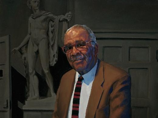 Chester M. Pierce, professor of education and psychiatry emeritus, lecturing in the Ether Dome at Massachusetts General Hospital.  Apollo stands behind him.