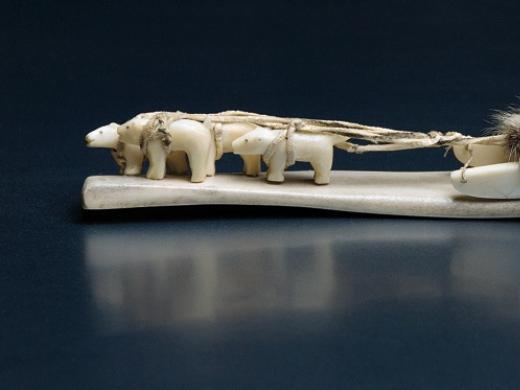 The Inuit artist who created this dogsled from carved ivory, leather, and sealskin is unknown.