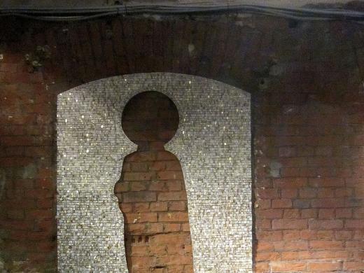 The mosaic <i>Absence</i> (2012) on a wall in Moscow